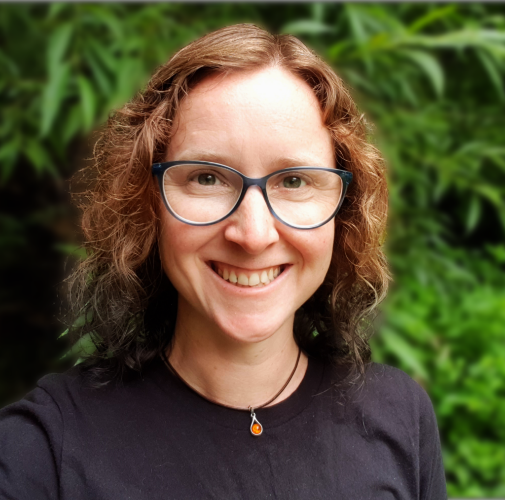 Portrait photo of Ruth Gerrard environmental bid writer with leafy background
